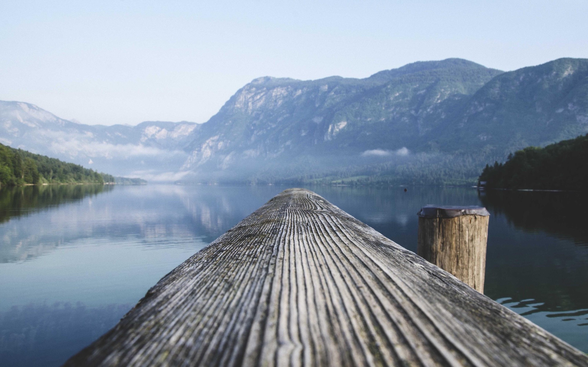 Wooden dock over a still lake